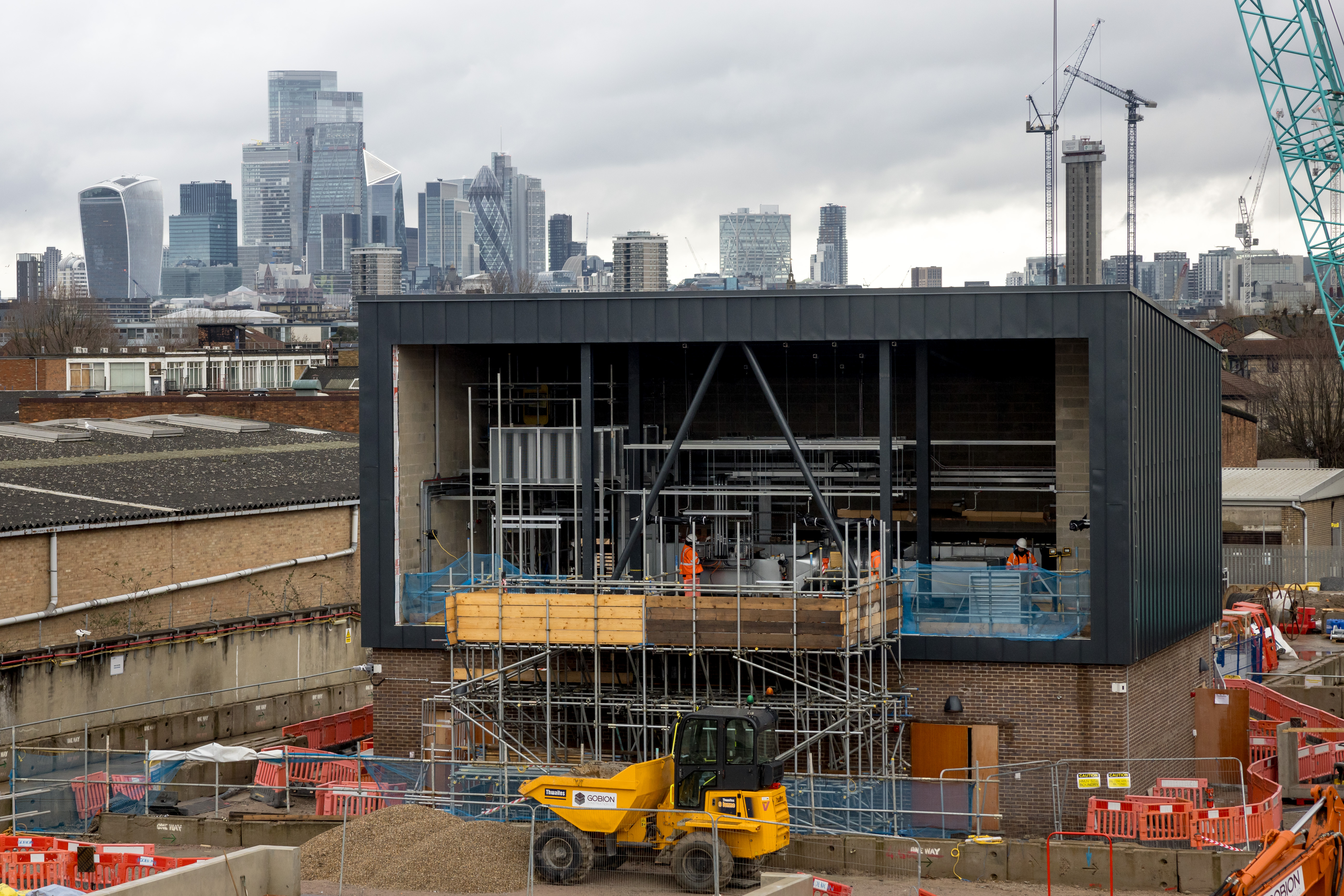 Construction site with London skyline in the background.