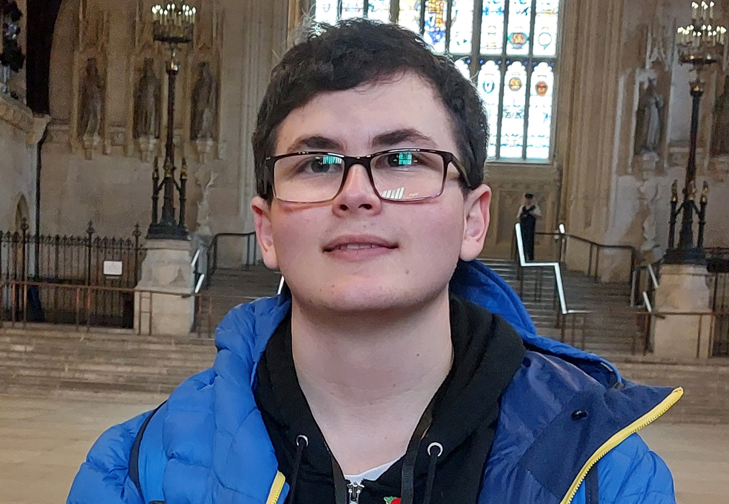 Josh Hall, a visitor wearing a blue jacket.