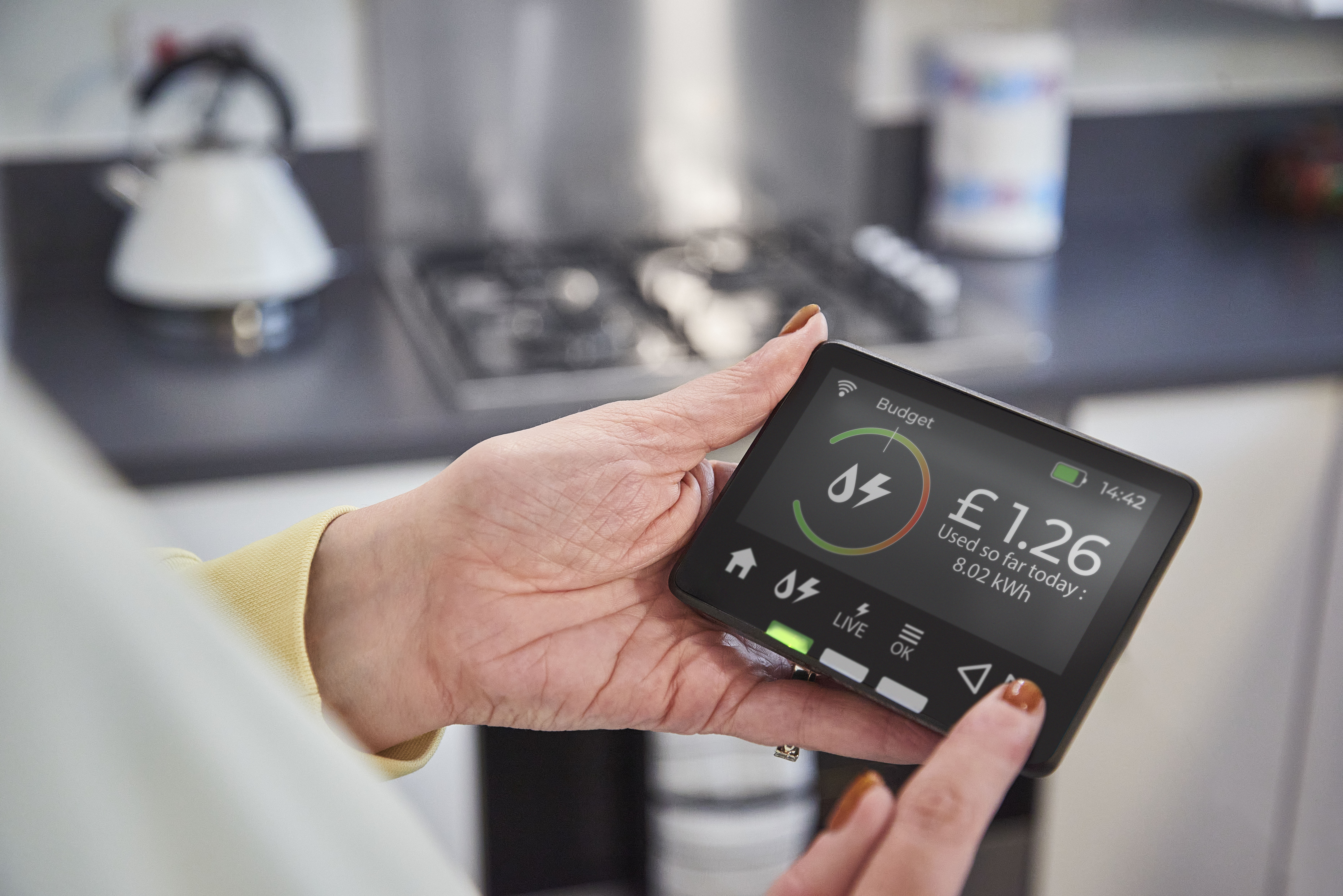Smart meter displaying energy consumption and cost.